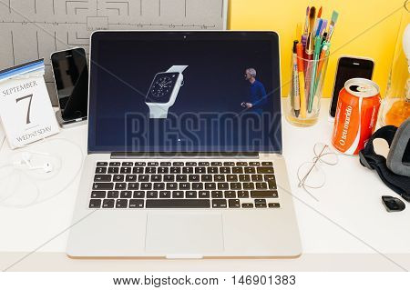 PARIS FRANCE - SEP 8 2016: Apple Computers website on MacBook Retina in room environment showcasing live coverage of Apple Keynote - introducing ceramic Apple Watch