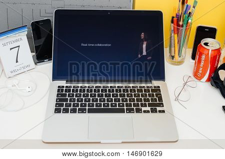 PARIS FRANCE - SEP 8 2016: Apple Computers website on MacBook Retina in room environment showcasing live coverage of Apple Keynote - iiWork suite eal-time collaboration for collaborative editing