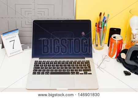 PARIS FRANCE - SEP 8 2016: Apple Computers website on MacBook Retina in room environment showcasing live coverage of Apple Keynote - presentation of iPhone new photo camera double camera