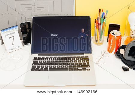 PARIS FRANCE - SEP 8 2016: Apple Computers website on MacBook Retina in room environment showcasing live coverage of Apple Keynote - presentation of iPhone new photo camera double camera