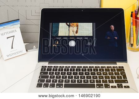 PARIS FRANCE - SEP 8 2016: Apple Computers website on MacBook Retina in room environment showcasing live coverage of Apple Keynote - presentation of iPhone new photo camera double camera