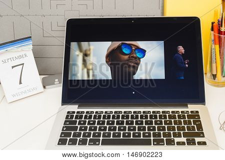 PARIS FRANCE - SEP 8 2016: Apple Computers website on MacBook Retina in room environment showcasing live coverage of Apple Keynote - presentation of iPhone new photo camera double camera
