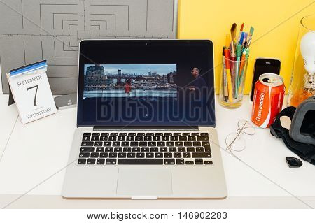 PARIS FRANCE - SEP 8 2016: Apple Computers website on MacBook Retina in room environment showcasing live coverage of Apple Keynote - presentation of iPhone new photo camera double camera