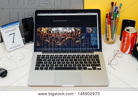 PARIS FRANCE - SEP 8 2016: Apple Computers website on MacBook Retina in room environment showcasing live coverage of Apple Keynote - Tim Cook talking about Apple Music Festival