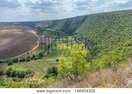 Moldavian village situated near nills with green forest