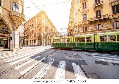 Turin, Italy - June 12, 2016: Street view with old green tram in the old city center of Turin in the morning in Piedmont region in Italy