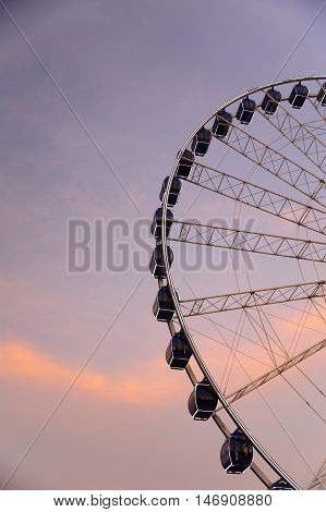 Ferris wheel over evening sky with copy space