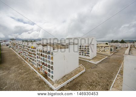 TULCAN, ECUADOR - JULY 3, 2016: overview of the city cemetery with lot of vertical graves and paths.