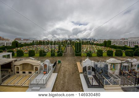 TULCAN, ECUADOR - JULY 3, 2016: nice overview of the gardens of the cemetery, nice plants sculptures surrounding graves.