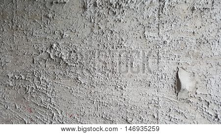 Rough concrete wall at construction site. Prepared and ready for plastering and painting.