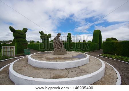 TULCAN, ECUADOR - JULY 3, 2016: religious statue located on the middle of the graveyard.