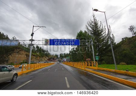 TULCAN, ECUADOR - JULY 3, 2016: boarder road between colombia and ecuador, thank you for visiting ecuador sign.