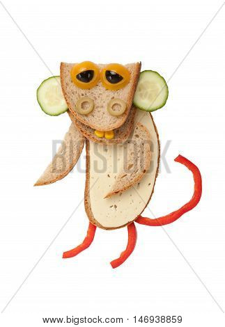 Funny monkey made of bread cheese and vegetables on white background