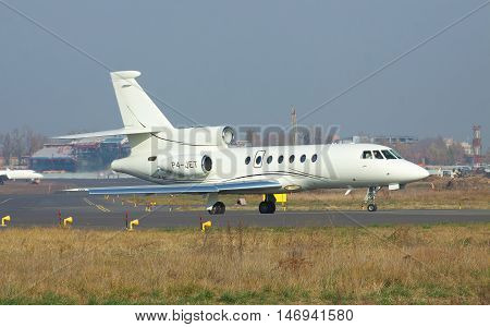 Kiev Ukraine - November 5 2011: Dassault Falcon 50EX business jet is on the runway in the airport before takeoff