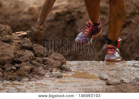 Mud race runners detail sports shoes.Extreme sport