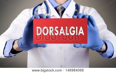 Doctor's hands in blue gloves shows the word dorsalgia. Medical concept.