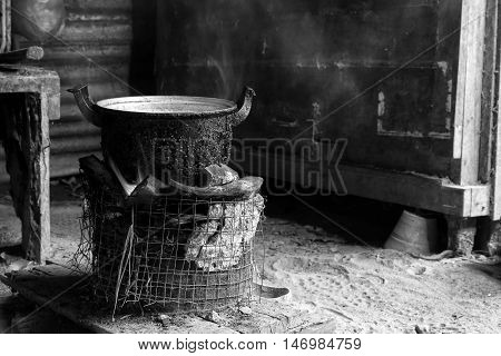 Cook with charcoal. Kitchen Thai traditional charcoal burning clay stove. Black and white color low key.