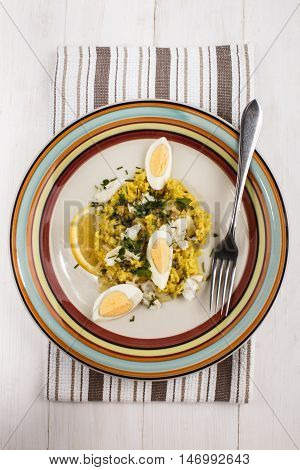 kedgeree a scottish meal with haddock basmati rice cardamom egg and lemon on a plate