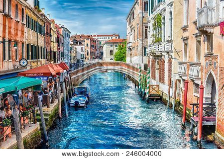 Venice, Italy - April 29: Traditional Gondolas With Scenic Architecture Along The Canal Rio Dei Grec