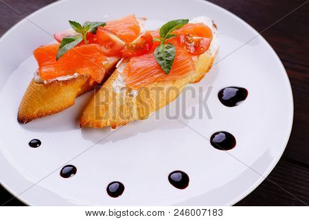 Italian Antipasto- Bruschetta With Smoked Salmon, Appetizing Popular Mediterranean Meals. Buffet, Re