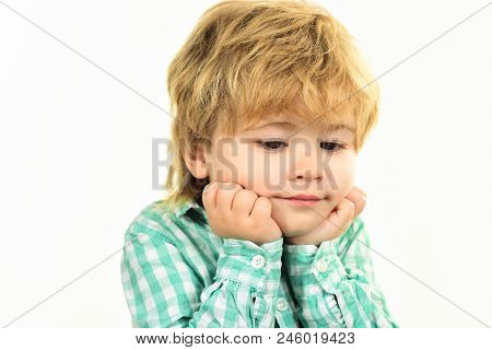 Small Boy In Green Shirt. Boy Holds Face On Hands. Close Up Portrait. Fashionable Little Child. Kis 