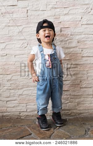 Asian Cute Baby Kid Happinese On White Brick Wall Background, Portrait Child Concepts.