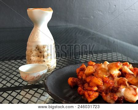 On Seletive Focus And Dark Image Of Fried Chicken Sauce Cook A Special Dish In Black. And The Teacup