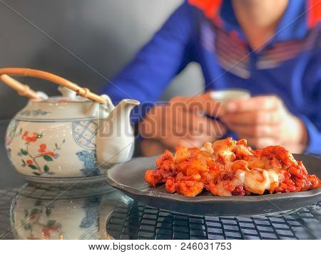 On Seletive Focus And Dark Image Of Fried Chicken Sauce Cook A Special Dish In Black. And The Teacup