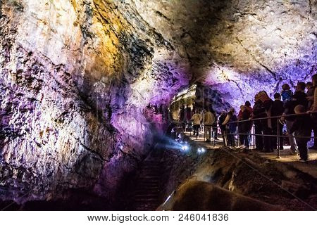 Han-sur-less, Belgium - April 29, 2017: Illuminated Multicolored Stalactites In Cave Han-sur-lesse I