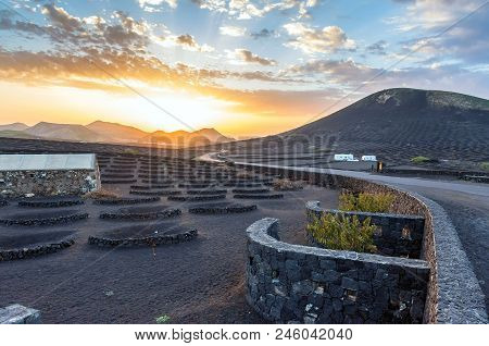 Lanzarote, Spain - December 27, 2016: Stunning Landscape With Sunset On Volcanic Vineyards In La Ger