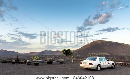 Lanzarote, Spain - December 27, 2016: Local Wineshop Called Bodega And Taxi With Volcanic Landscape 
