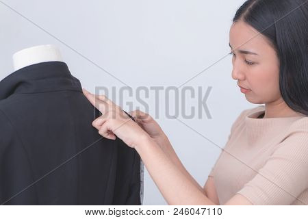 Female Tailor Is Measuring A Gentlement Suit Jacket