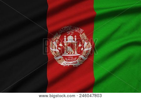 Afghanistan Flag Is Depicted On A Sports Cloth Fabric With Many Folds. Sport Team Waving Banner