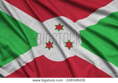 Burundi Flag  Is Depicted On A Sports Cloth Fabric With Many Folds. Sport Team Waving Banner
