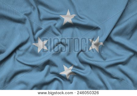 Micronesia Flag  Is Depicted On A Sports Cloth Fabric With Many Folds. Sport Team Waving Banner