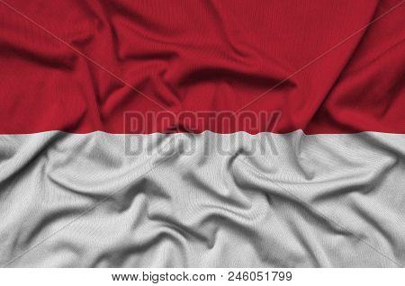 Indonesia Flag  Is Depicted On A Sports Cloth Fabric With Many Folds. Sport Team Waving Banner