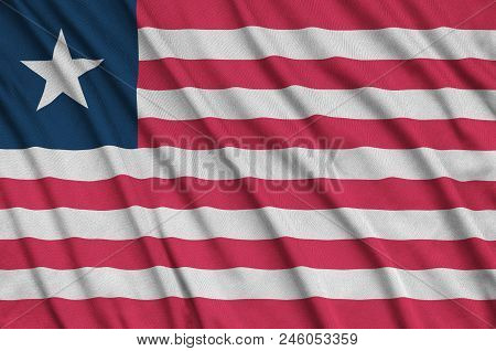 Liberia Flag  Is Depicted On A Sports Cloth Fabric With Many Folds. Sport Team Waving Banner