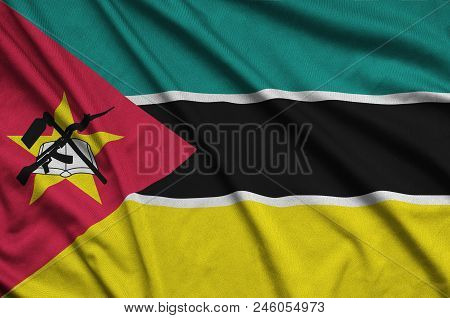 Mozambique Flag  Is Depicted On A Sports Cloth Fabric With Many Folds. Sport Team Waving Banner