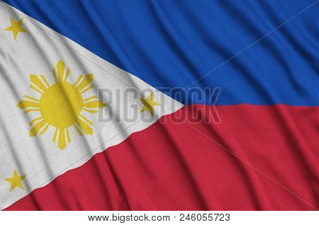 Philippines Flag  Is Depicted On A Sports Cloth Fabric With Many Folds. Sport Team Waving Banner