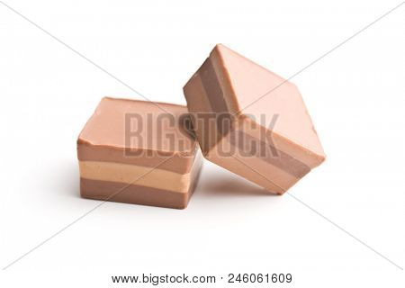 Sweet nougat pralines isolated on white background.
