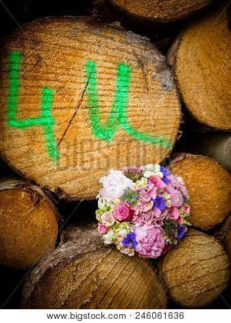 The Bridal Bouquet With Pink Peonies, Daisies And Pink Roses Lies On The Wooden Floor, Background, O