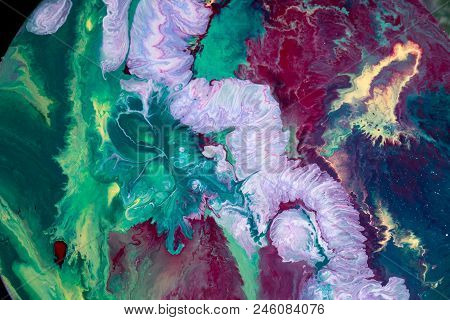 Abstraction Of The Flowing Multi-colored Acrylic Paints