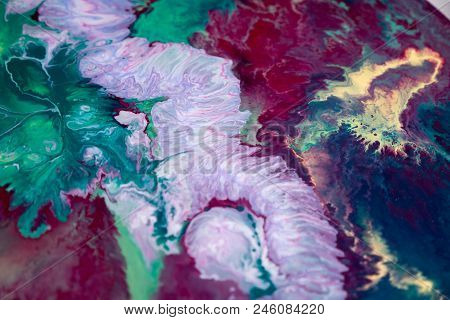 Abstraction Of The Flowing Multi-colored Acrylic Paints