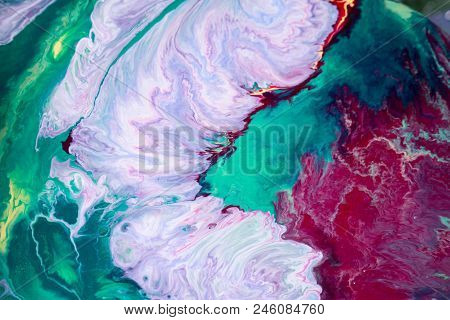 Abstraction Of The Flowing Multi-colored Acrylic Paints