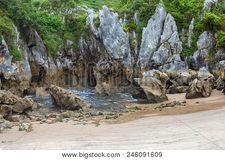 the famous beach gulpiyuri, in Asturias, Spain