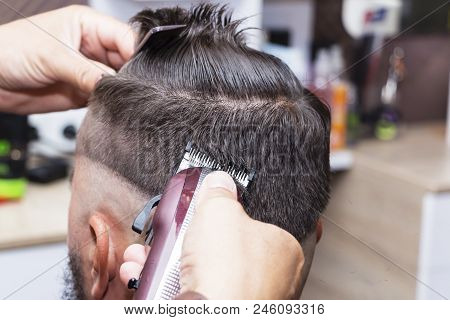 Men's Hair Styling And Grooming With The Help Of Scissors Machine And Hair Clippers In The Hair Salo