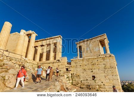 Tourists Decendig The Propylaea, Ancient Principal Entryway To The Acropolis On A Summer Afternoon
