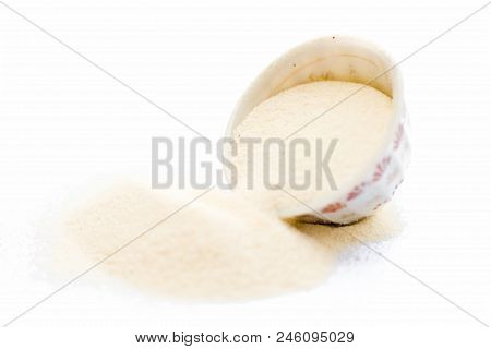 Semolina Flour In A White Colored Bowl Isolated On White Also Known As Sooji Or Suji.