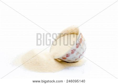 Semolina Flour In A White Colored Bowl Isolated On White Also Known As Sooji Or Suji.