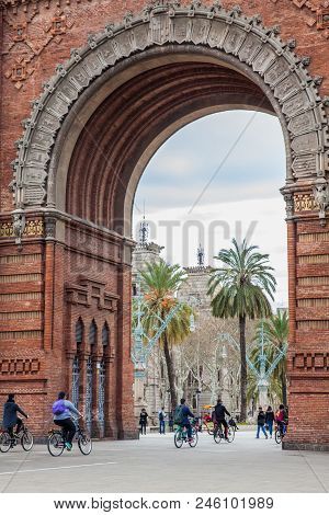 Barcelona - March, 2018: People On A Bike Tour At The Triumphal Arch In Barcelona Spain